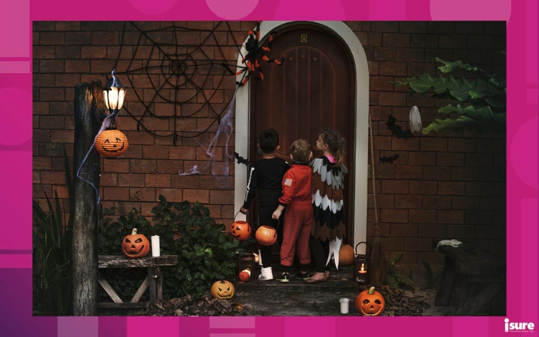 halloween safety tips - children trick or treating on Halloween night dressed in costumes