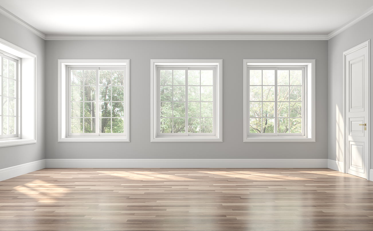 Classical empty room interior 3d render,The rooms have wooden floors and gray walls ,decorate with white moulding,there are white window looking out to the nature view. Vacant home insurance