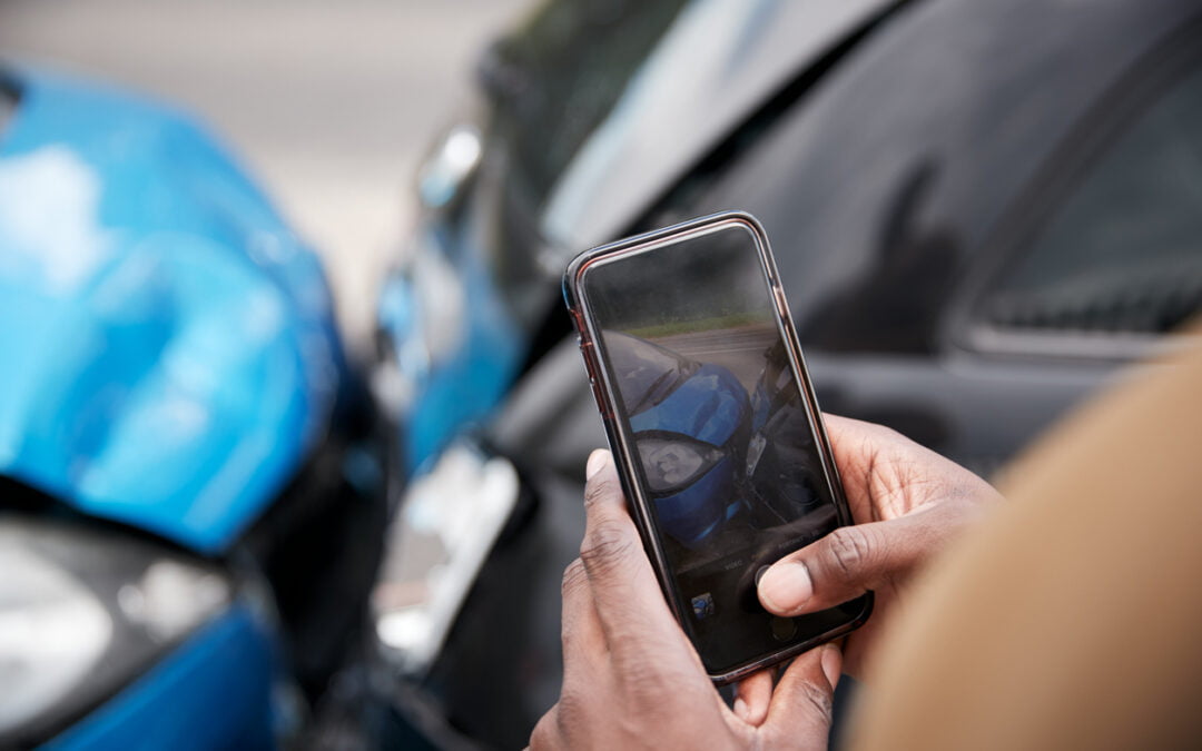 Male Motorist Involved In Car Accident Taking Picture Of Damage For Insurance Claim - most common types of car accidents