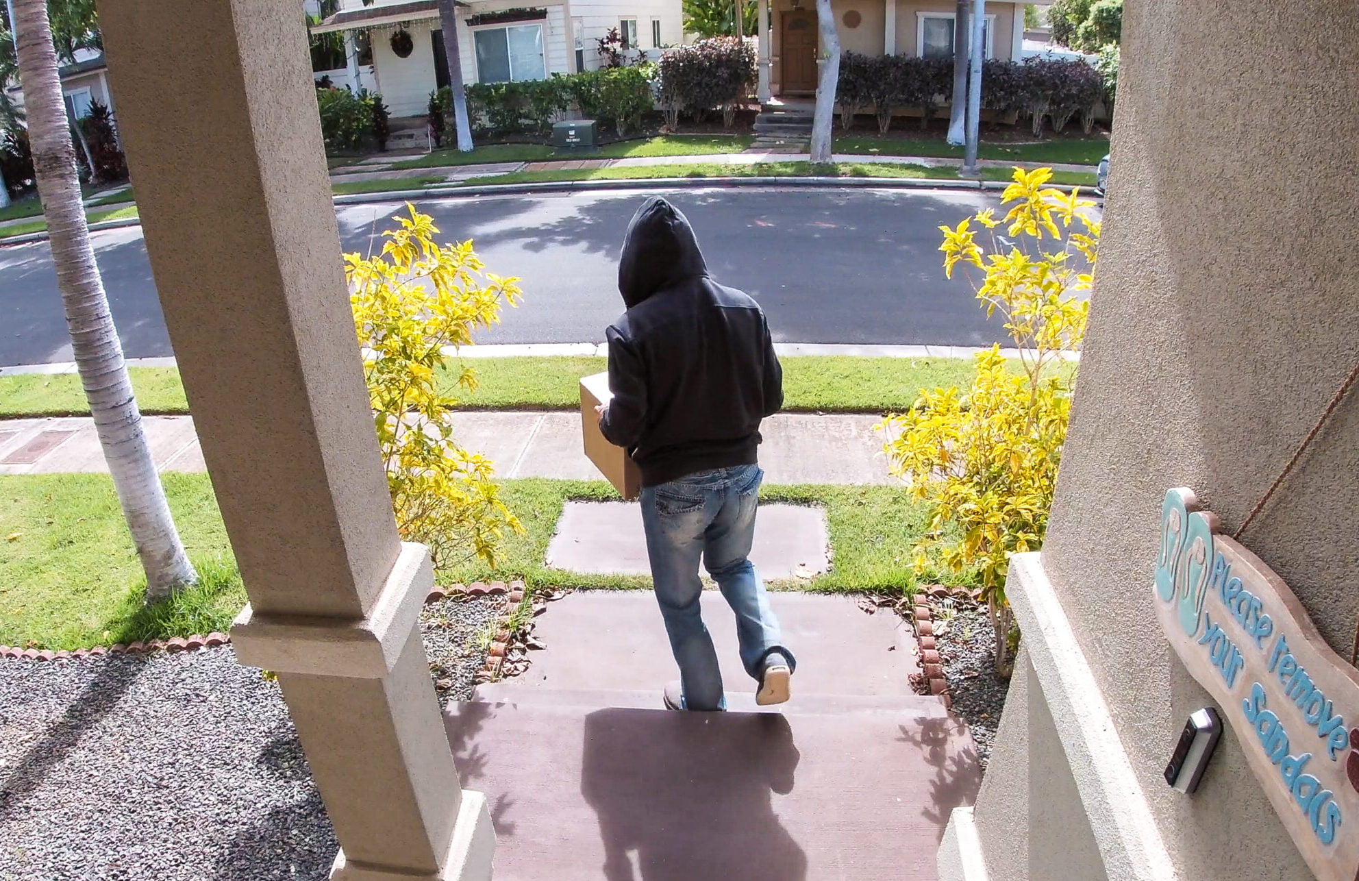 Package thief caught on video doorbell system stealing a box - porch pirates
