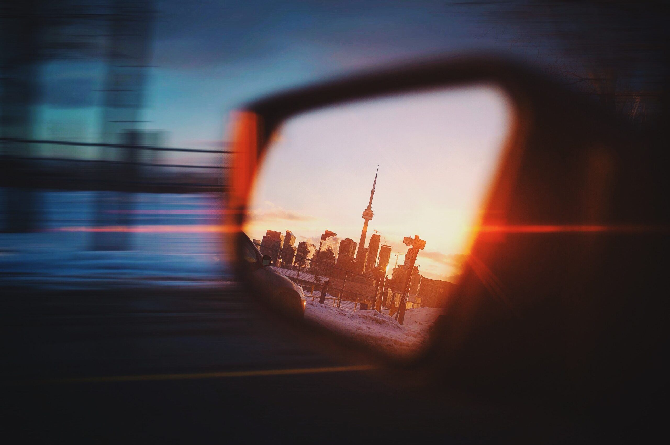 Toronto skyline in rearview mirror