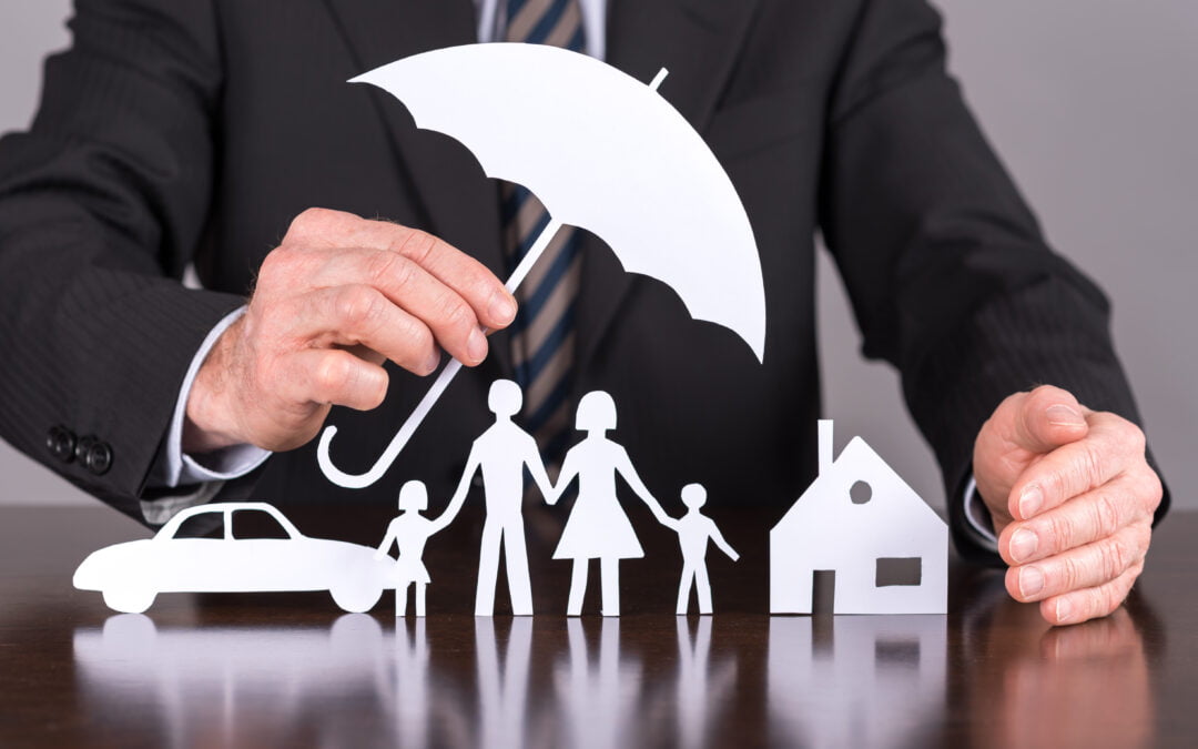 insurance broker holding an umbrella over insurance options - FAQs about insurance brokers