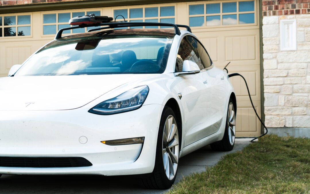 White Tesla Model 3 Charging at Home - charging your electric vehicle at home