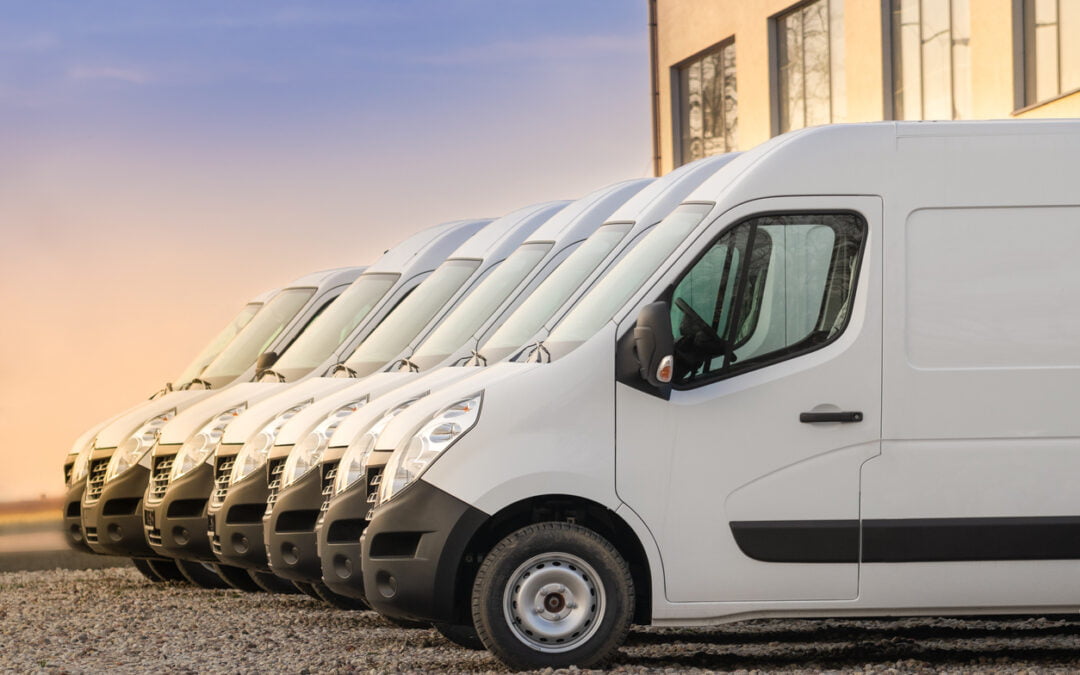 commercial delivery vans parked in row. Transporting service company. - commercial auto insurance