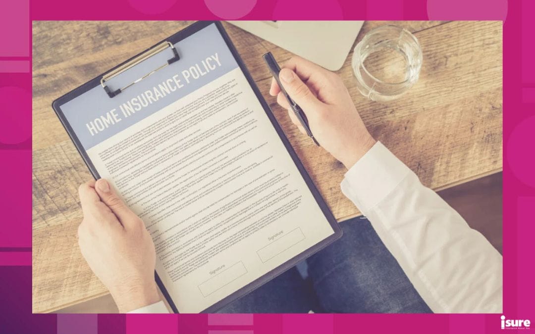 a close up of someone's hands holding a home insurance policy up close, examining the terms of their insurance deductible
