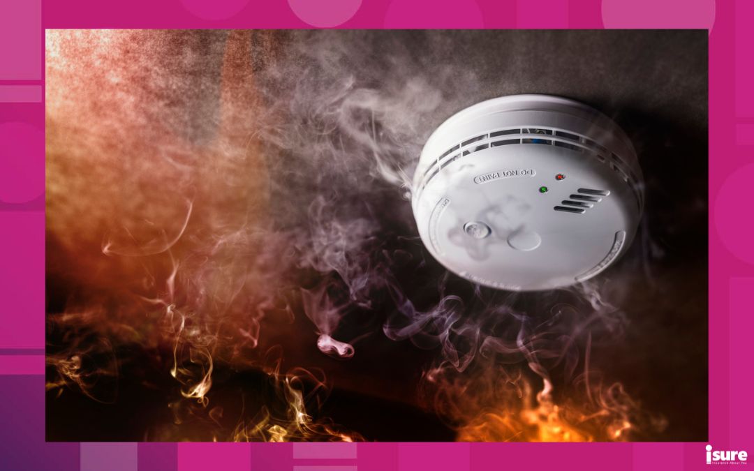 fires and home insurance - Smoke detector and fire alarm in action background with copy space