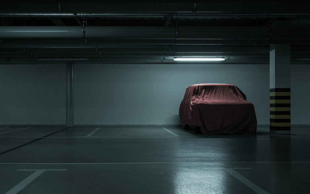OPCF 16 & OPCF 17 - Red covered vintage car in empty underground parking background with copy space