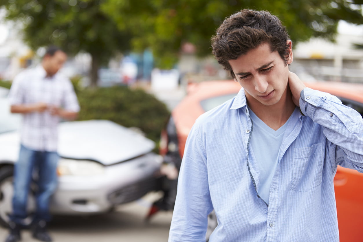 third-party liability coverage - Teenage Driver Suffering Whiplash Injury Traffic Accident Rubbing Neck With Hand