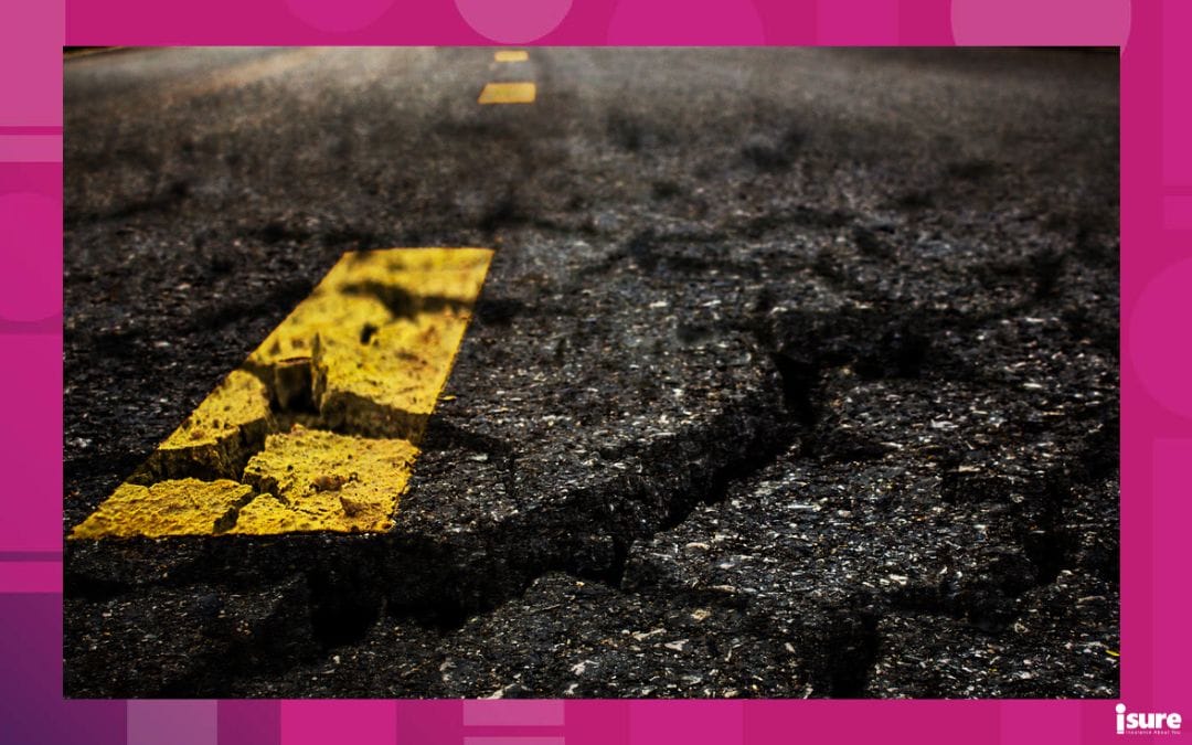 Crack textured asphalt road background, representing the worst roads in ontario