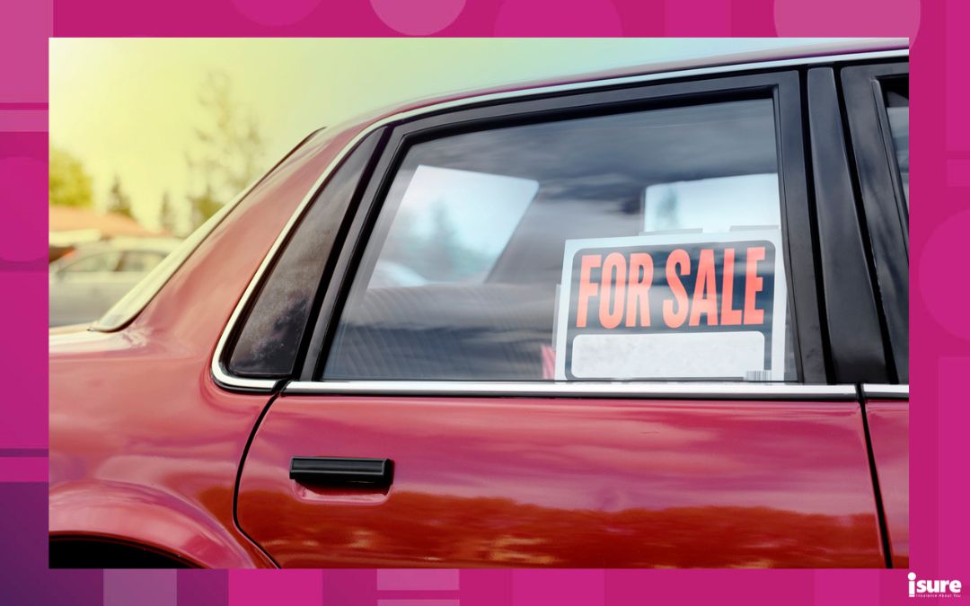 buying used vehicles - shiny car for sale in summer weather, parked with a red vibrant color exterior.