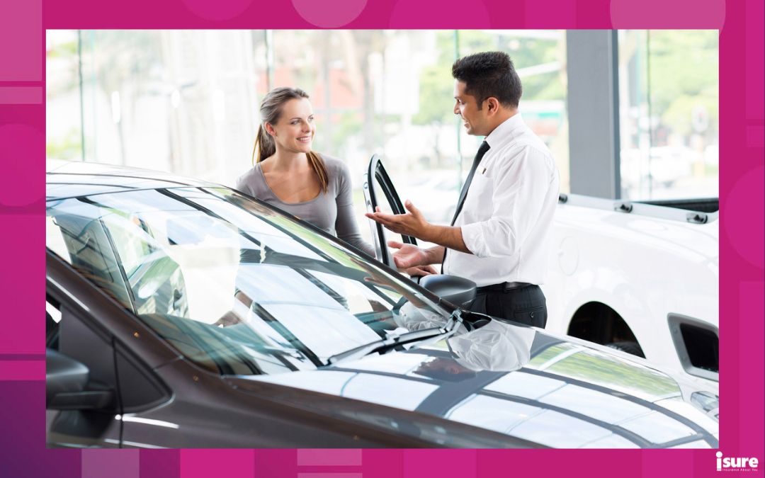 can you buy a car without insurance - friendly vehicle dealer showing young woman new car