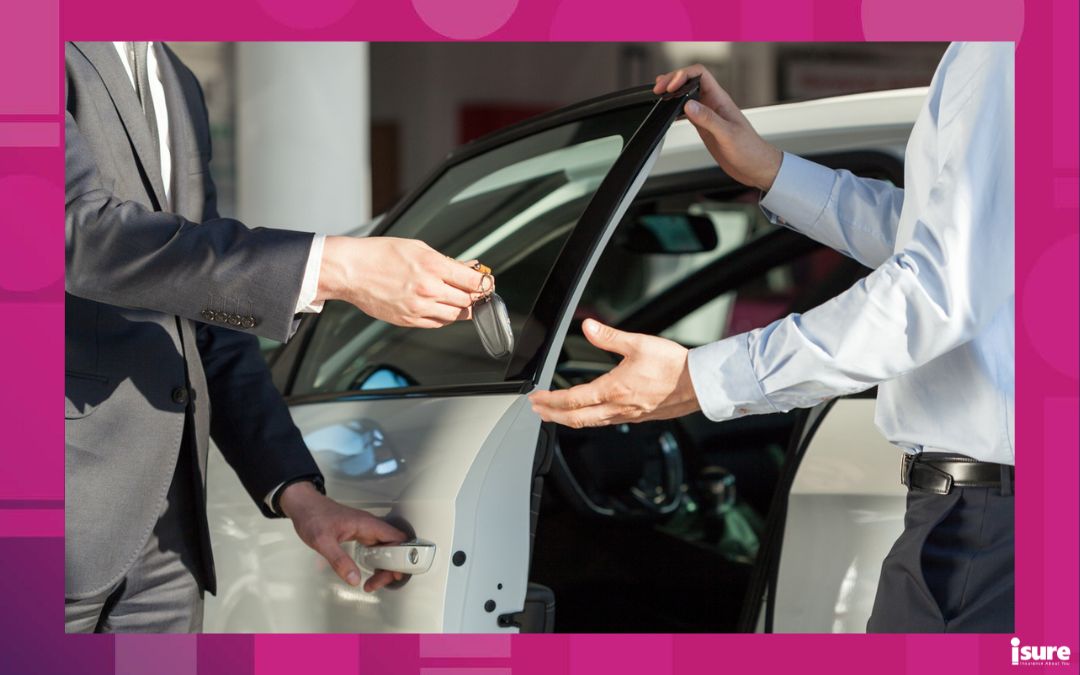 car trade-in - Salesman's hands giving key to male customer