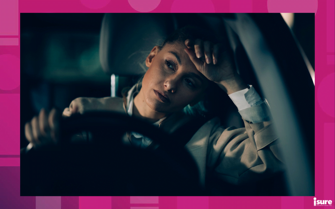 common driving mistakes - a tired woman driving her car late at night.
