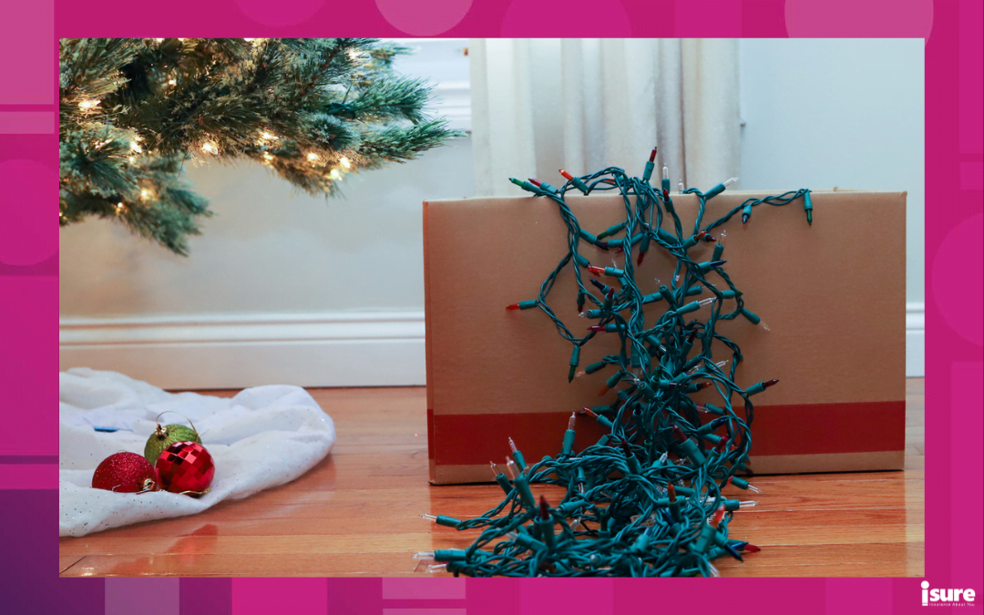 holiday storage tips - A string of Christmas lights in a box of Christmas decorations