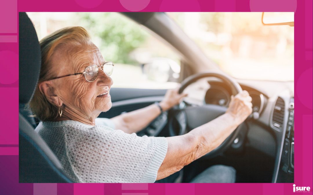 senior driver's licence renewal - Elderly woman behind the steering wheel of a car