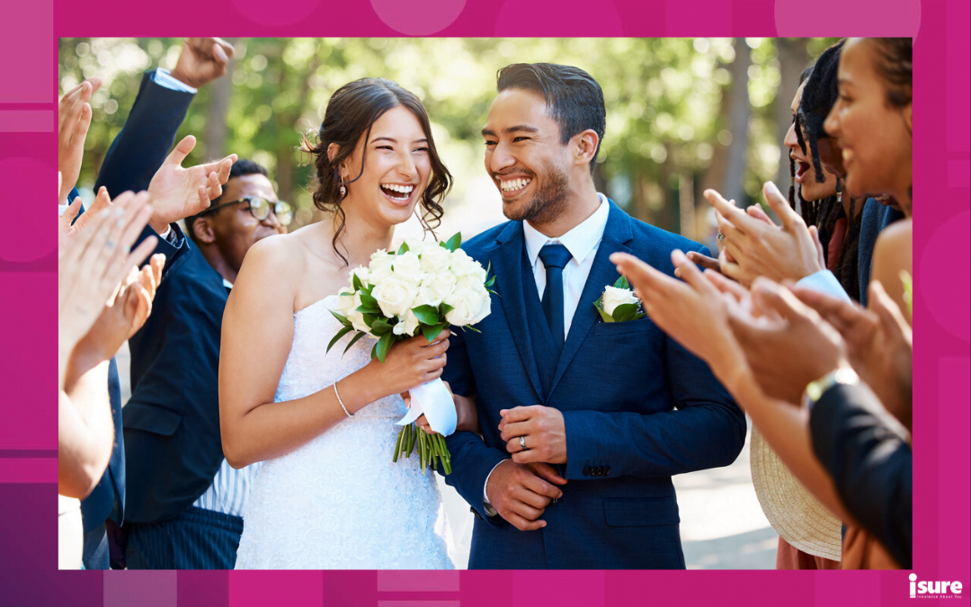 insurance policy changes - Wedding guests clapping hands as the newlywed couple walk down the aisle. Joyful bride and groom walking arm in arm after their wedding ceremony
