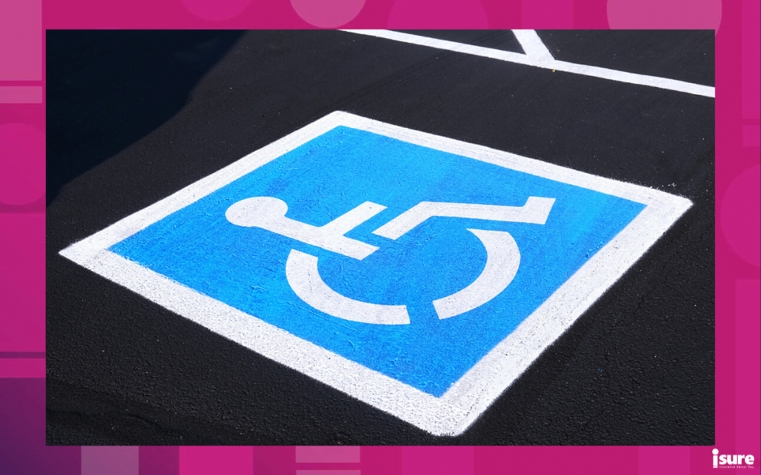 accessibility parking permit parking spot - Disabled parking space with white and blue painted sign of handicapped parking spot on blacktop asphalt surface close-up photo. Accessibility concept.