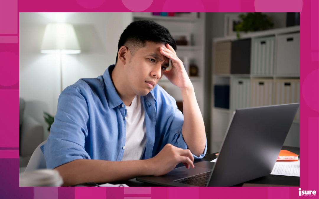 home is underinsured - Unhappy young Asian man, entrepreneur, student, tutor looking at laptop screen with serious and worried face and with hand on forehead when working or learning from home.