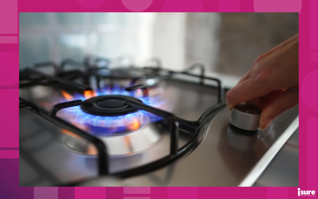 gas safety tips - Woman turning on the gas burner on the stove.