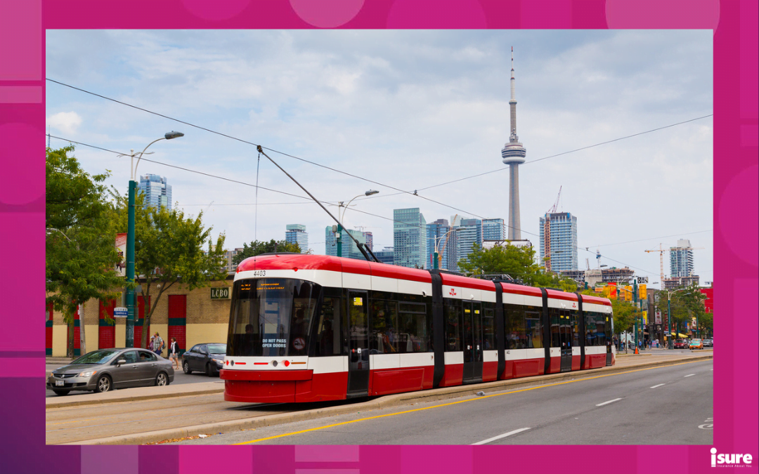 driving in Toronto - Toronto, Canada - September 9, 2014: A view of the new Toronto Street Cars during the day. Passengers can be seen on the vehicle