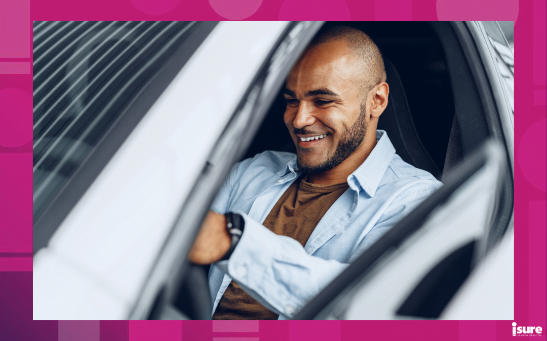 apply for car insurance - Portrait of a handsome happy African American man sitting in his newly bought car close up