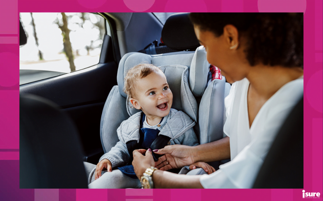 best booster seats - Happy baby girl looking at her mother in a car. Woman fastening safety belts while daughter looking on her.