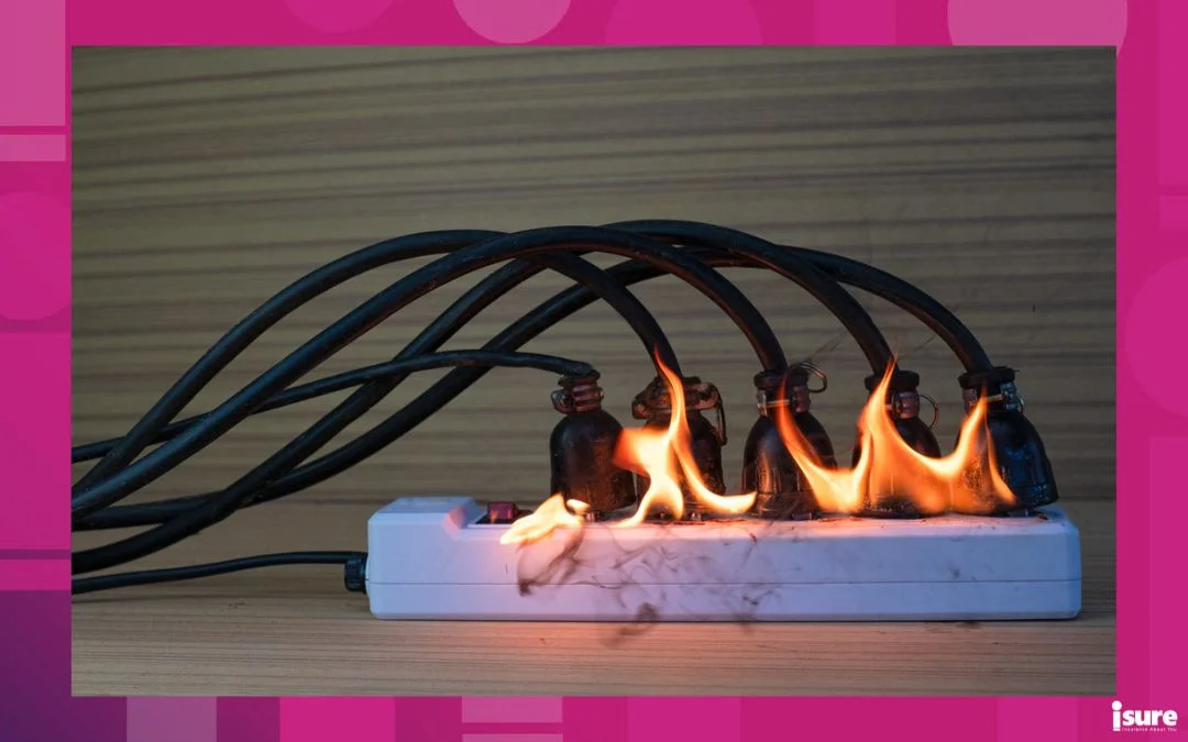 electrical damage - On fire multi-socket with the connected power strip with a bunch of plugs on wood background