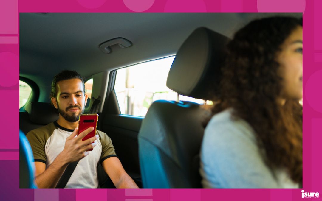 rideshare drivers injured - Attractive young man passenger taking a trip with a driver of a ride share app service and texting
