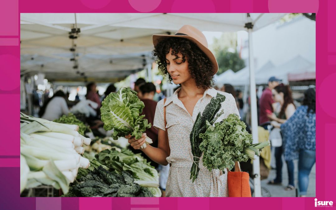 farmers' markets in Ontario - Beautiful woman buying kale at a farmers market