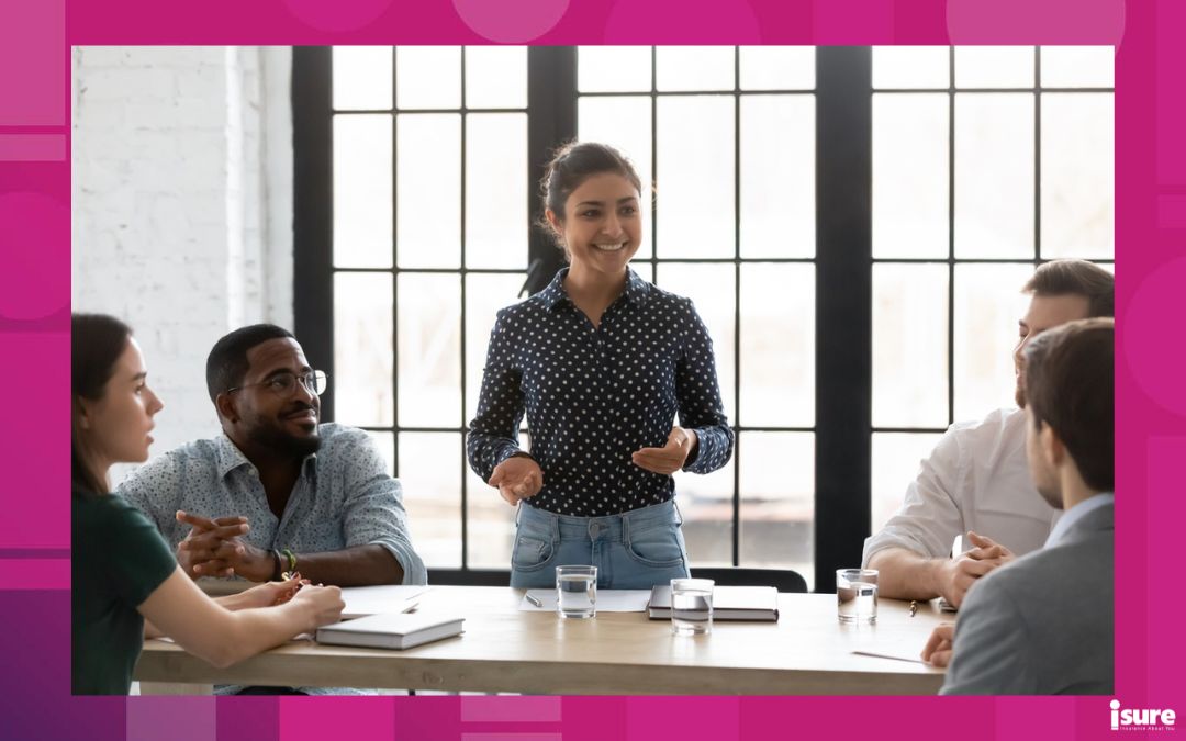 inspirational quotes for business owners - Happy Indian business leader holding corporate meeting with diverse team of employees. Mentor training group of interns. Coach teaching new hired employees. Young female boss instructing staff