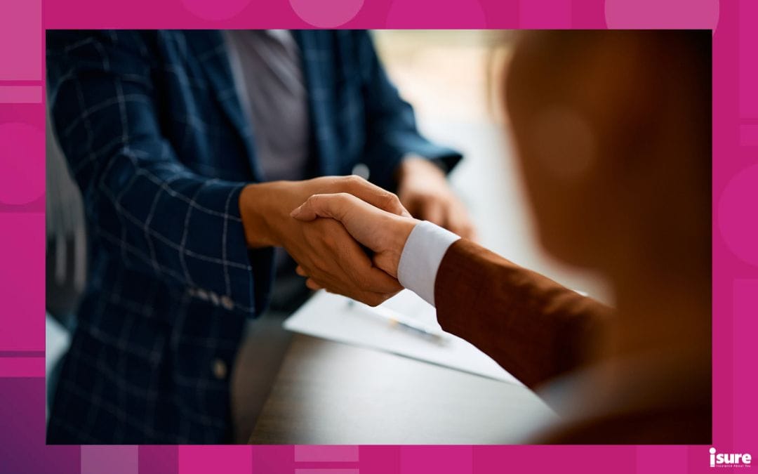 Insurance broker shakes hands with a satisfied customer. Broker customer service