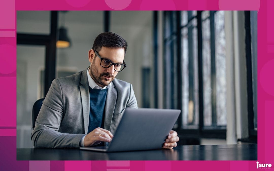 Increases in Cyber Attacks - Concentrated adult man, checking on his staff from the office, on laptop.