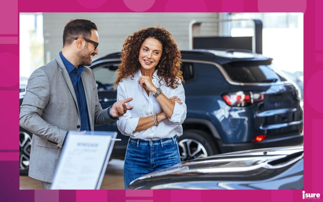 car flood damage - Woman in the showroom enjoying luxury car. Happy salesman selling the car to his female customer in a showroom. Auto business, car sale, consumerism and people concept