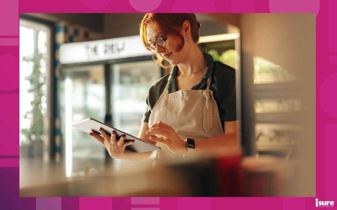 A business owner uses an iPad to help run her business. AI apps for business