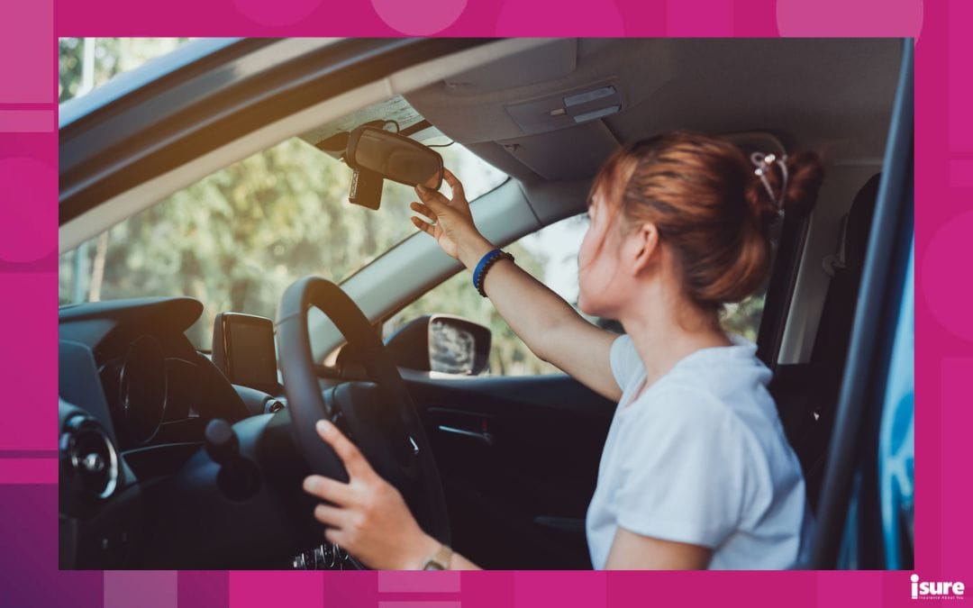 Safety driving woman adjust the car rearview mirror in interior before start travel trip every time - cost of insurance for G2 drivers