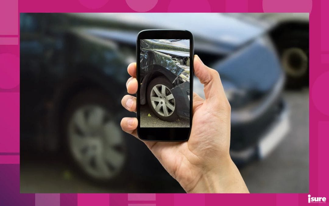 collision coverage - up close photo of car accident damage on a cell phone