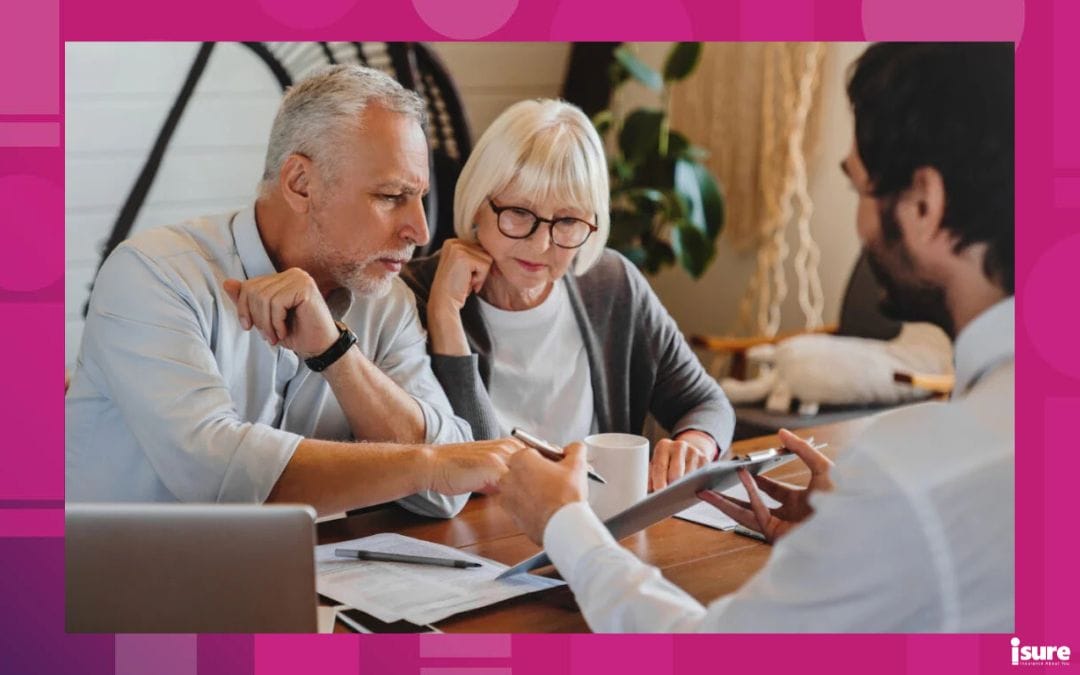 elderly couple meeting with their insurance broker to discuss how switching insurers may or may not affect insurance rates