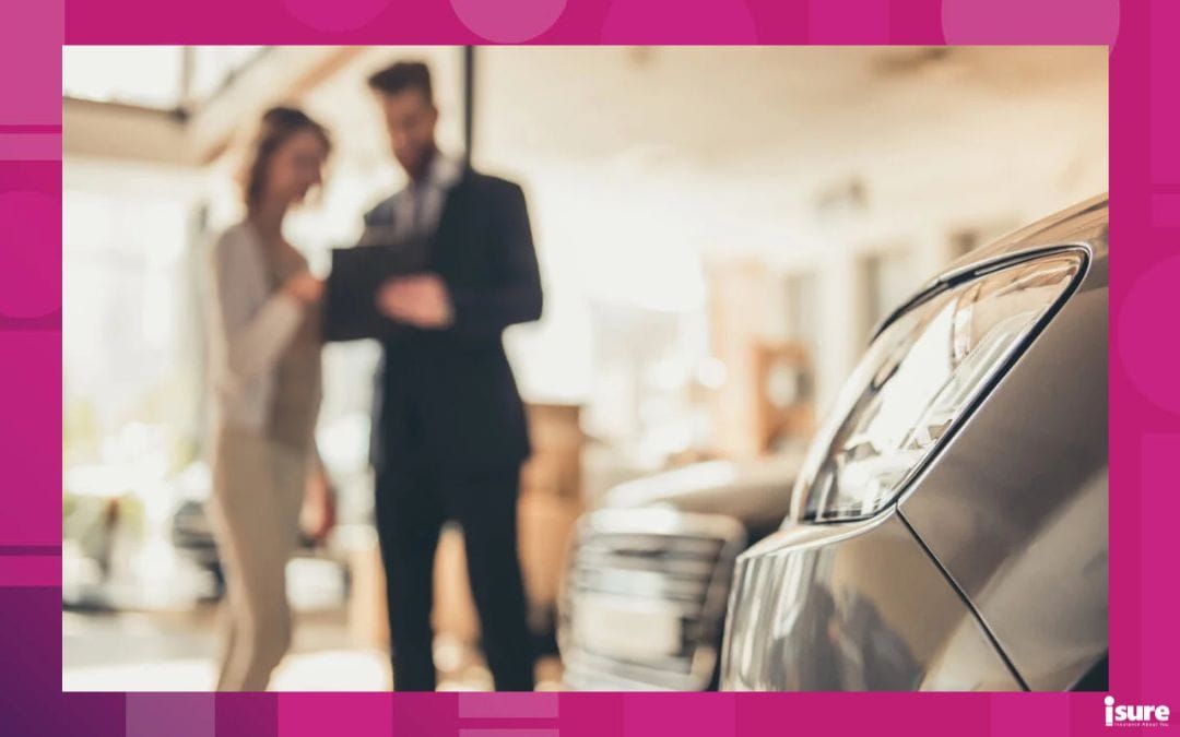 a salesperson and a buyer looking at to buy a vehicle, and deciding whether to lease or finance