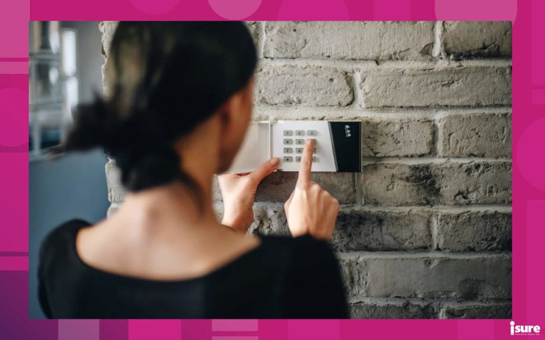 Young woman entering security pin on home alarm keypad. Home security system - lower your home insurance rates with home improvement