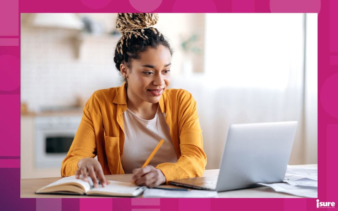 Focused cute stylish african american female student with afro dreadlocks, studying remotely from home, using a laptop, taking notes on notepad during online lesson, e-learning concept, smiling. Leanr about the importance of students and tenant insurance