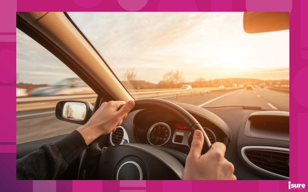 driving on highway, high speed, hands of driver closeup on steering wheel - high car insurance prices in ontario