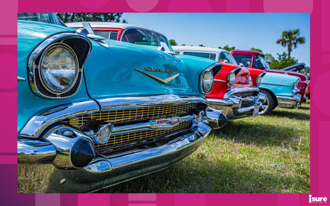 A lineup of different coloured classic cars in Ontario.