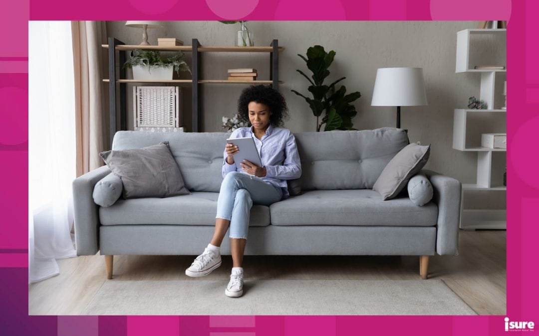 Young African American woman sit relax on couch at home use modern tablet gadget browse internet. Millennial biracial female rest on sofa talk speak on video webcam call on pad device online - renter's checklist