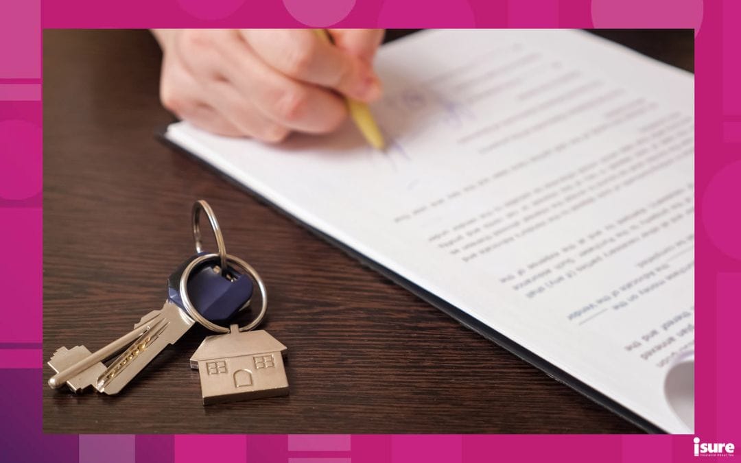 Someone signs their mortgage papers.