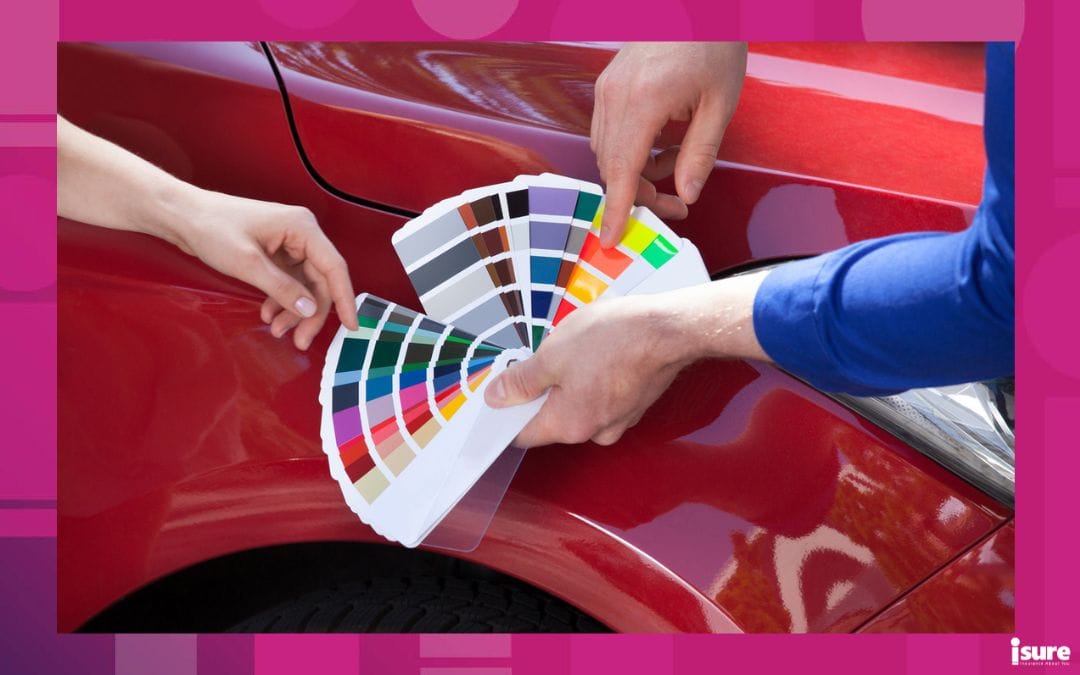 Cropped image of mechanic showing color samples to customer against car - photo accompanying blog about auto insurance myths