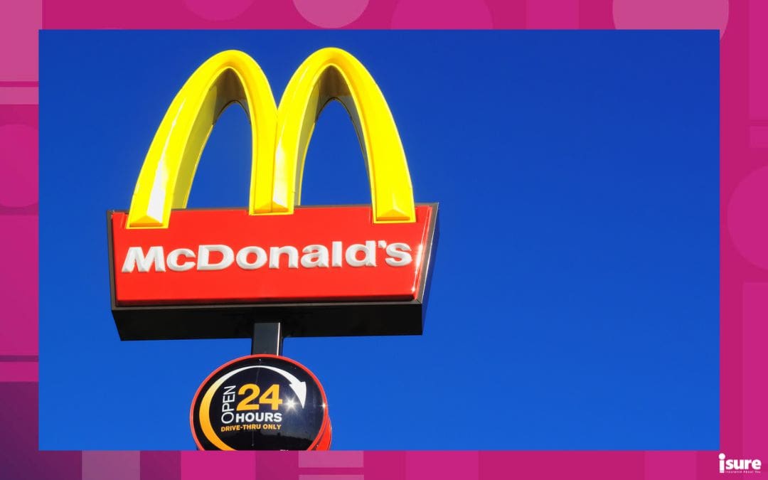 McDonald\'s yellow and red logo advertising sign placed on a pole with a clear blue sky with copy space - franchise insurance