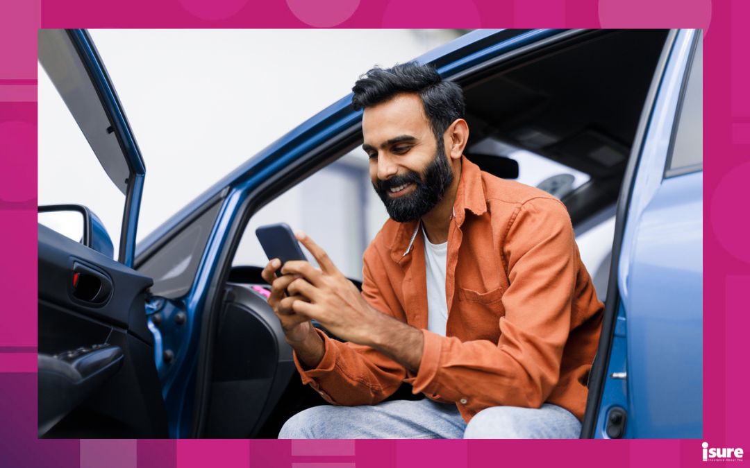 Car Navigation Application. Happy Middle Eastern Man Using Phone Sitting In Auto With Opened Door, Searching Best Way Via Mobile Gps Navigator App, Posing With Gadget In Luxury Automobile reviewing common auto insurance terms in his policy