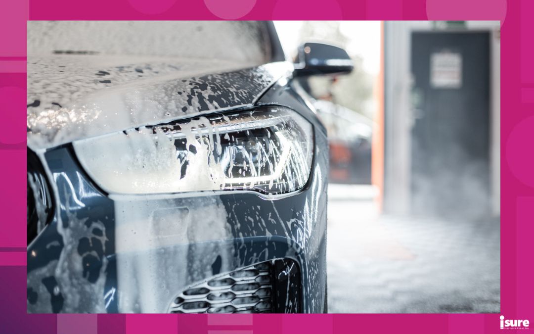 Car with optics in foam at the car wash in the garage. Car care and car wash in the detailing center - how long do cars last? Maintenance is a great contributing factor