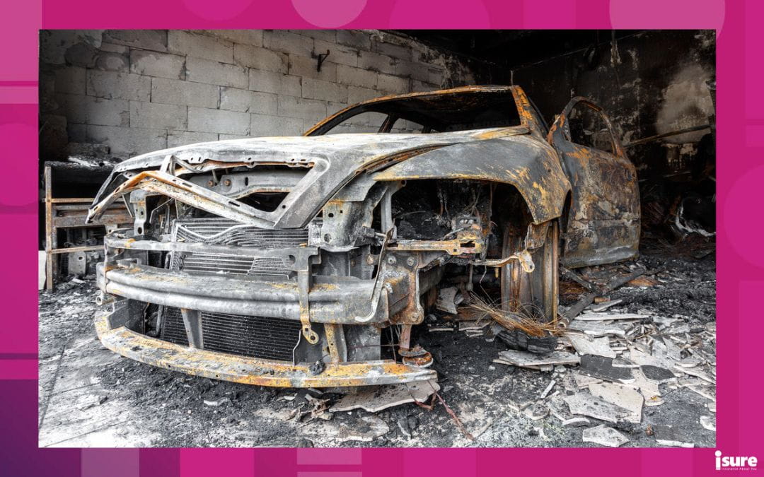 Close up photo of a burned out car damage in garage after house fire