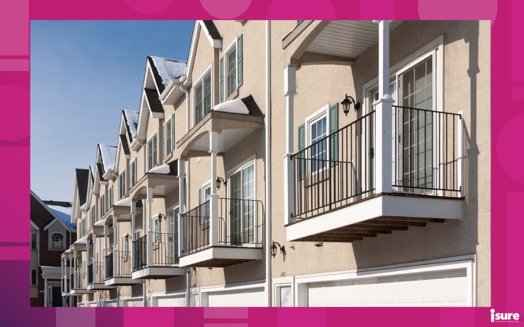 Row of modern townhouses with balconies, representing rent increases and housing costs in Ontario.